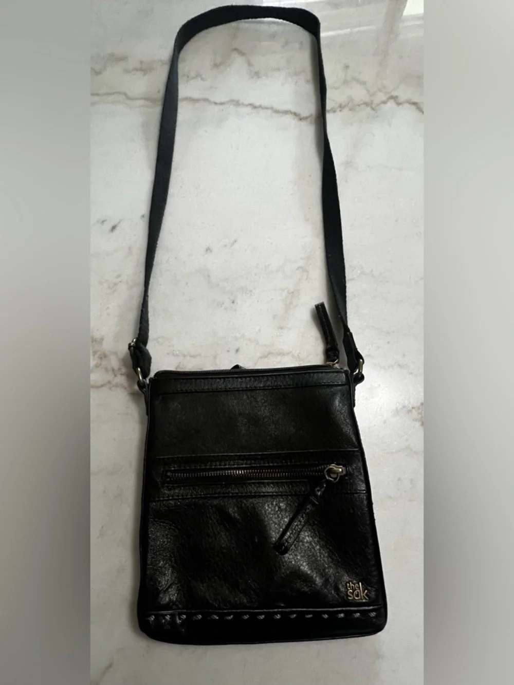 The Sak Black Leather Crossbody Bag with Gold Hardware And Colorful Lining